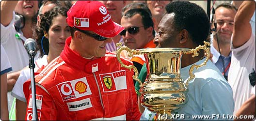 Michael Schumacher at Interlagos, Brazil presented with a trophy by Pelle - f1live.com