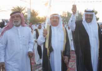 Minister bin Rajab with a sword dancing the ardhah