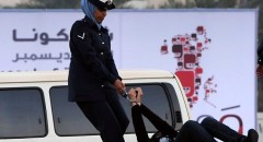 Zainab Al-Khawaja being bodily dragged by policewoman