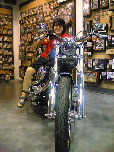 Arif astride a Harley Davidson motorcycle