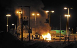 A police jeep set ablaze by Molotov cocktail bomb