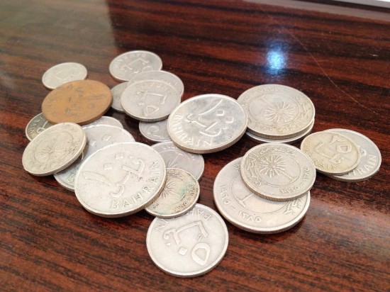 Old Bahraini coins of 10 fils, 25 fils, 50 fils and 100 fils - no longer in circulation